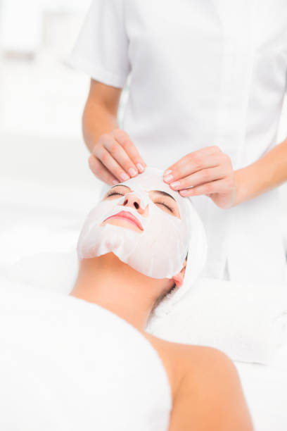 istock Beautiful brunette getting a facial treatment 666506976