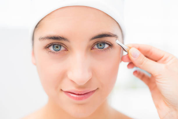 istock Hand applying eyeshadow to beautiful woman 666507098