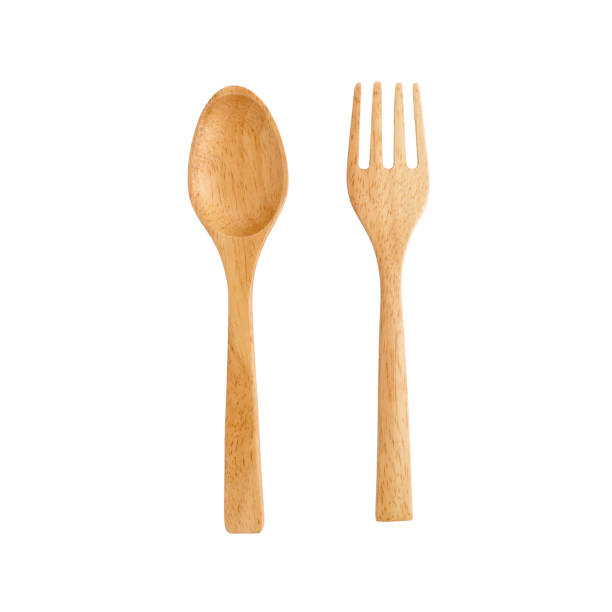 istock wooden spoon and wooden fork on white background. 666510806
