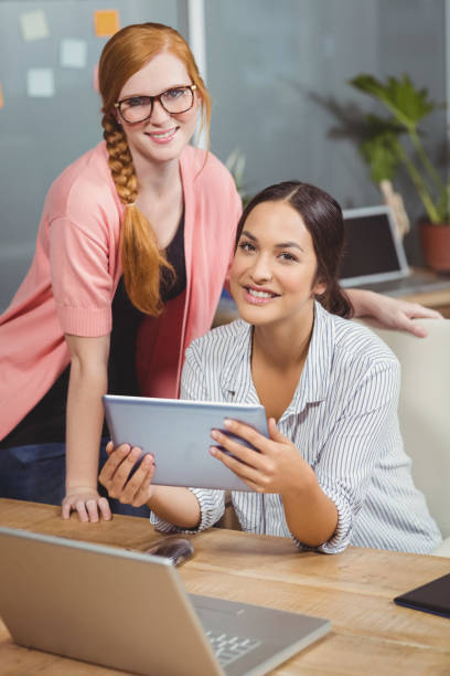 istock Portrait of businesswomen using digital tablet 666513812