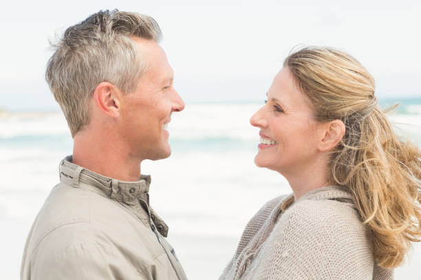 istock Happy couple standing holding each other 666514354