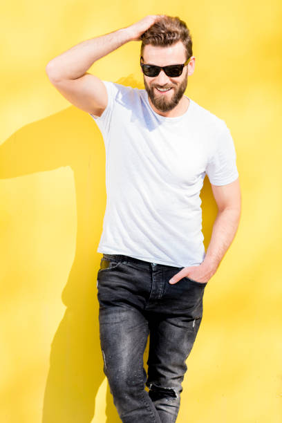 istock Portrait of a man on yellow background 666516806
