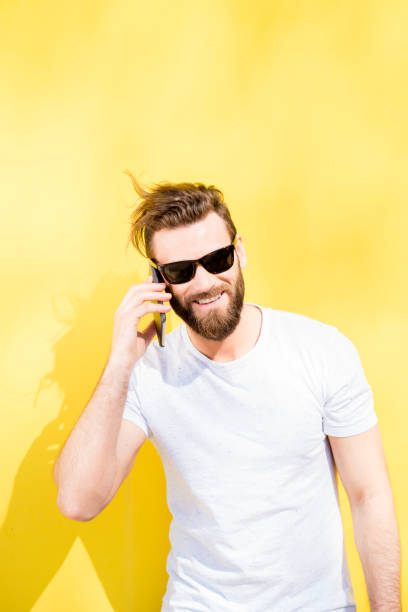 istock Portrait of a man on yellow background 666517004