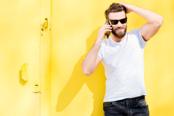 istock Portrait of a man on yellow background 666517034