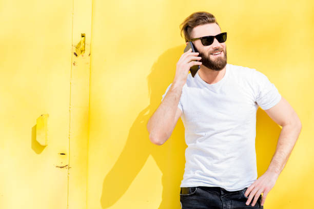 istock Portrait of a man on yellow background 666517070