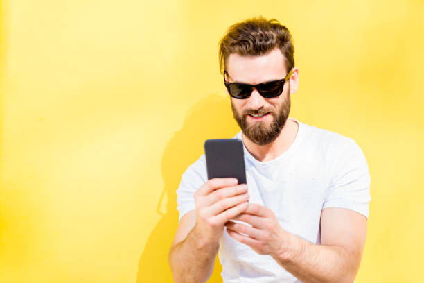 istock Portrait of a man on yellow background 666517120