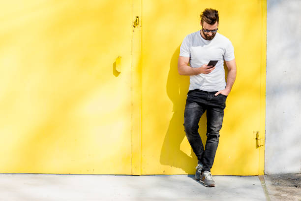 istock Portrait of a man on yellow background 666517384