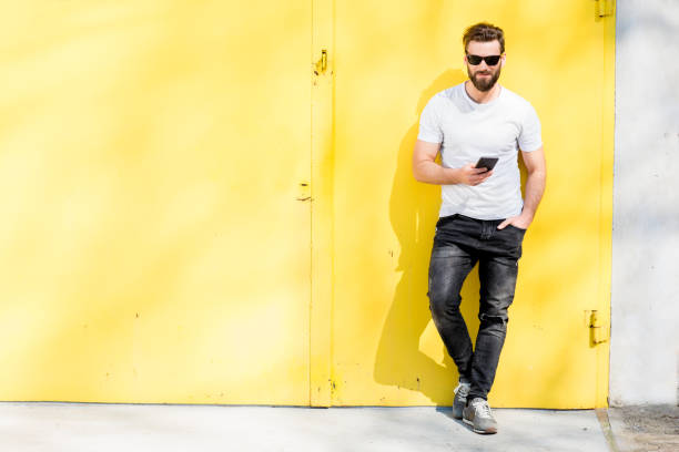 Portrait of a man on yellow background