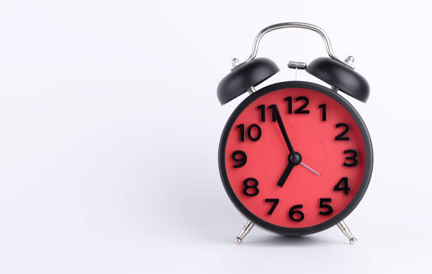 istock Red Alarm clock set to morning isolated on white copy space 666521270