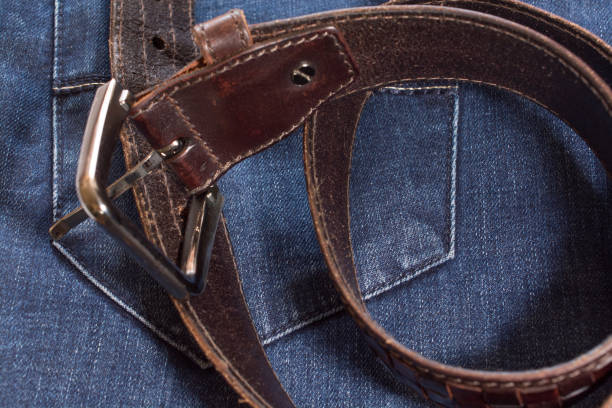 istock Leather belt on the jeans background. 666523618