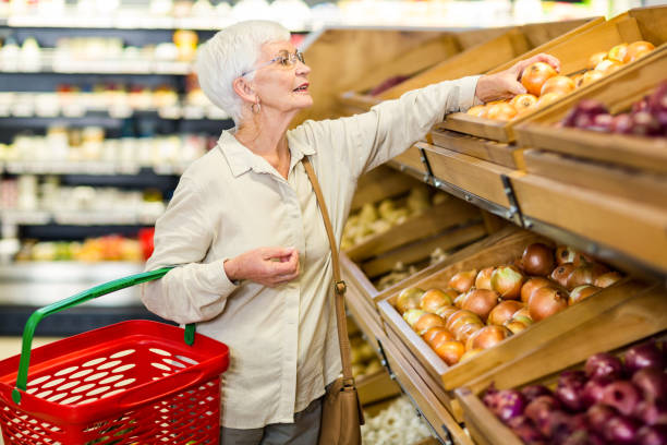 istock Senior woman picking out some vegetables 666526404
