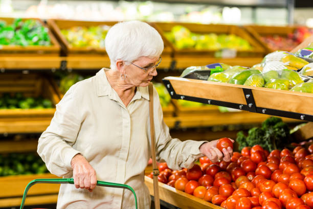 istock Senior woman picking out some vegetables 666526510