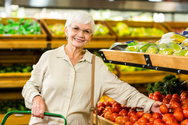 istock Senior woman picking out some vegetables 666526542