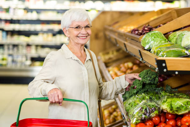 istock Senior woman picking out some vegetables 666526620