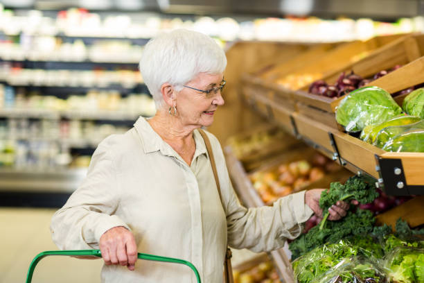 istock Senior woman picking out some vegetables 666526690