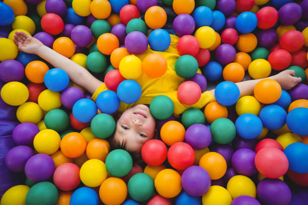 istock Cute smiling boy in sponge ball pool 666530034