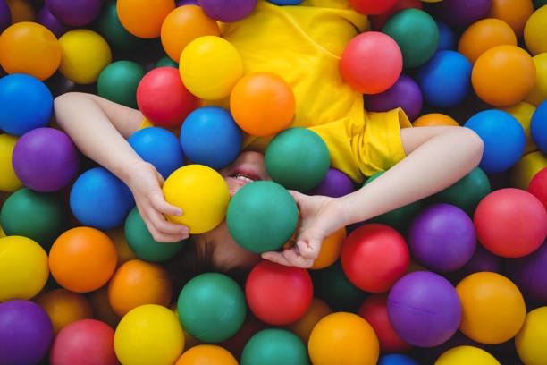 istock Cute smiling boy in sponge ball pool 666530076