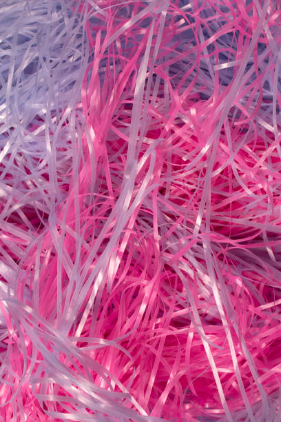 istock Pink and Blue shredded plastic fake Easter grass background 666530206