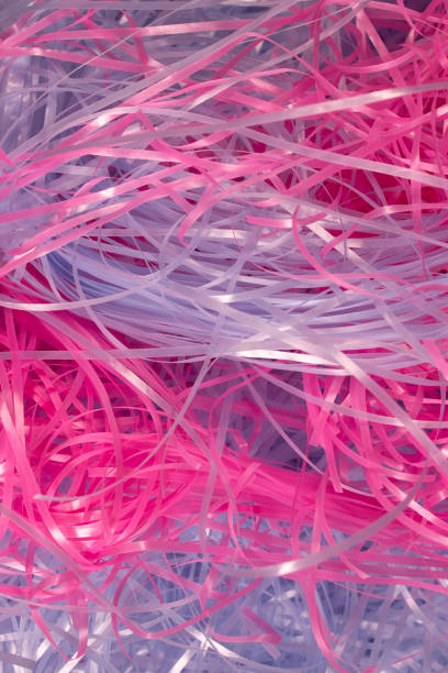 istock Pink and Blue shredded plastic fake Easter grass background 666530218