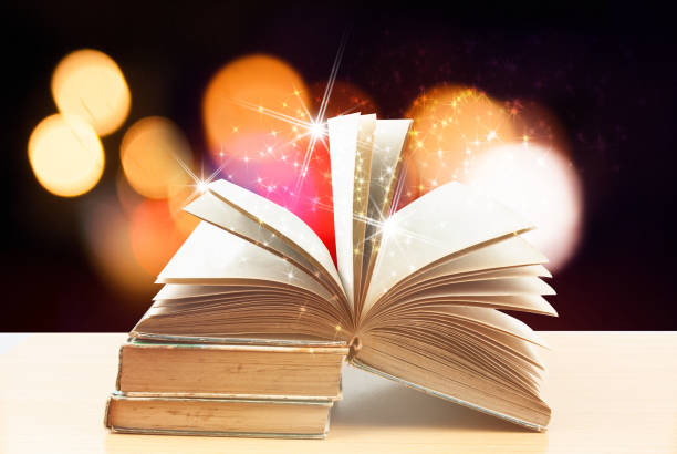 istock Abstract magic book on wooden background 666530378