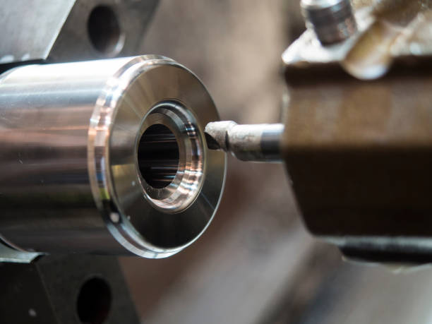 istock operator machining mold and die part by CNC turning machine 666532788