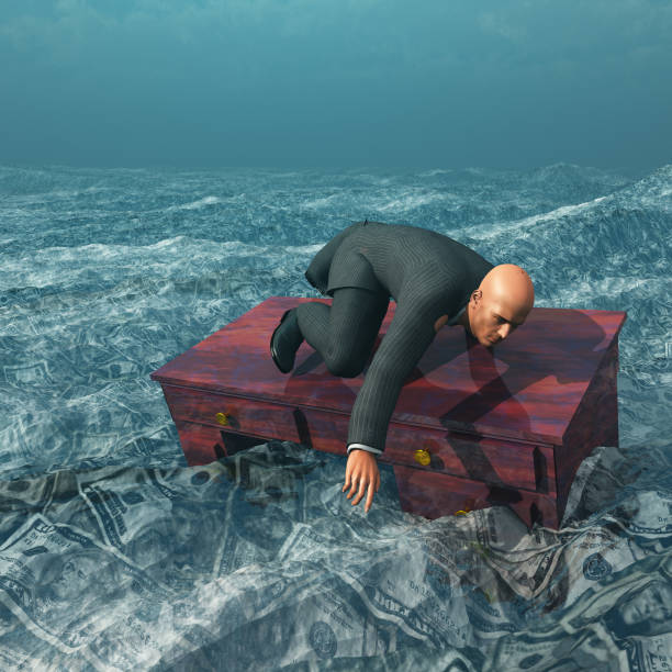 istock Man afloat on desk in sea of currency 666533208