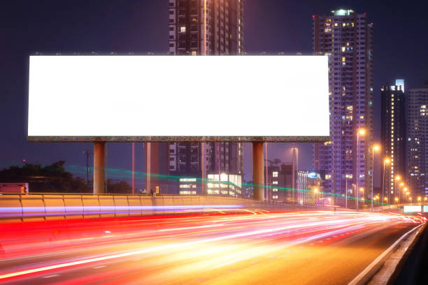 istock Blank billboard on light trails, street in the night 666533258
