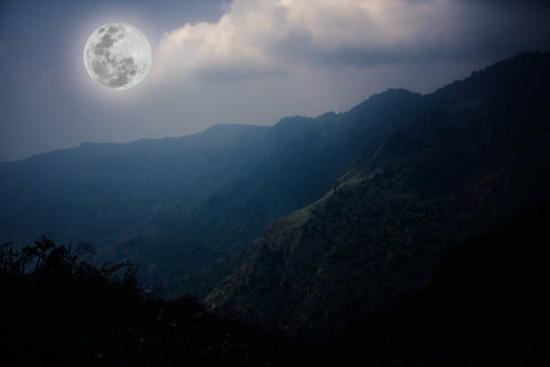 istock Mountain peaks with sky and beautiful full moon. 666533516