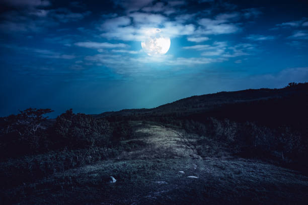 istock Mountain peaks with sky and beautiful full moon. 666533594