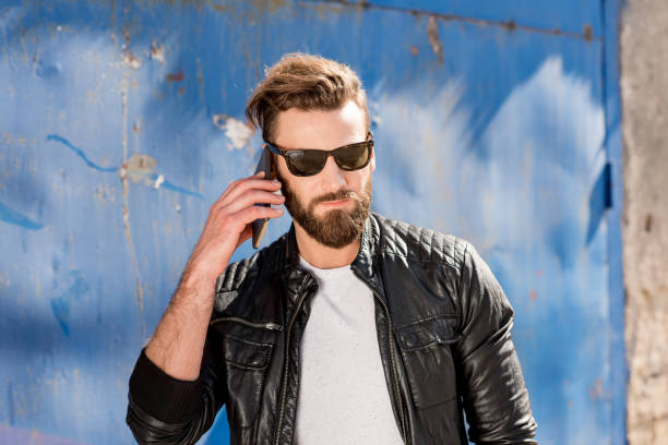istock Man with phone on the blue background 666536504