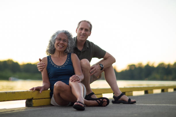 istock Older mature couple poses on dock after kayaking 666540172