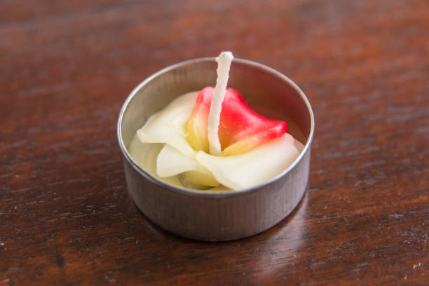 istock Beautiful scented candles orchid bullpen on white background. 666540404
