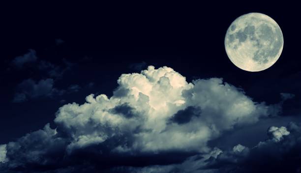 istock Night sky and a full moon in the clouds 666545484