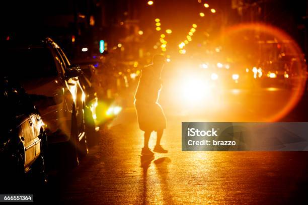 Man Crosses Busy Road At Night Stock Photo - Download Image Now - Pedestrian, Crash, Night