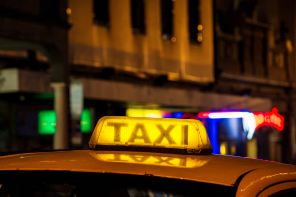 istock Taxi at night with sign on cab roof 666551604