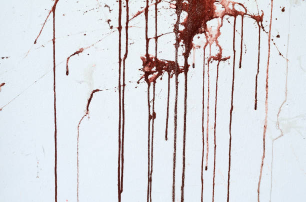 istock Background texture cement white wall with red blood-like paint streaks 666552444