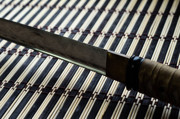 Japanese sword katana on a bamboo mat