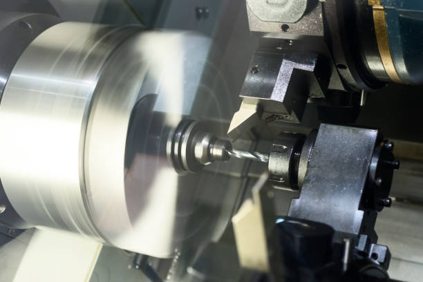 istock The CNC lathe processes the metal part 666559000