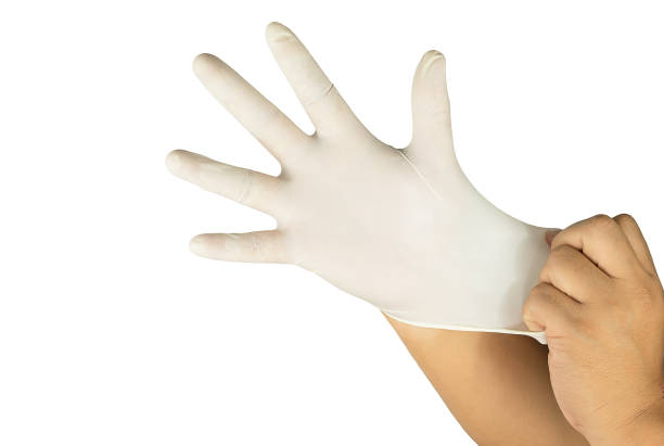 istock Doctors hands putting on sterile glove isolated white 666563126