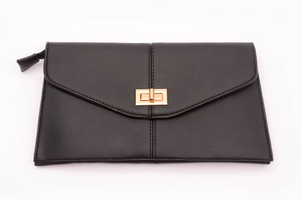 istock Black leather clutch isolated on white 666563156