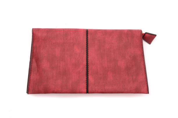 istock Burgundy leather clutch isolated on white 666563234