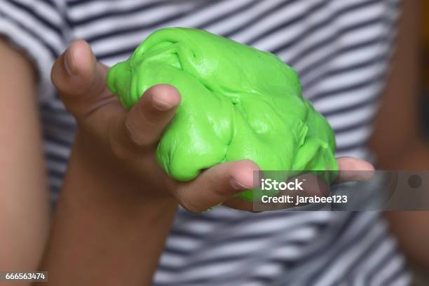 Kid Playing Hand Made Toy Called Slime Experiment Scientific Method Stock Photo - Download Image Now