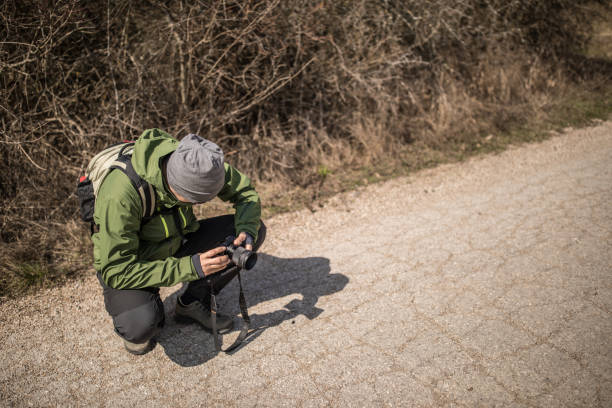istock Photographer is making photos on the forest road 666573326