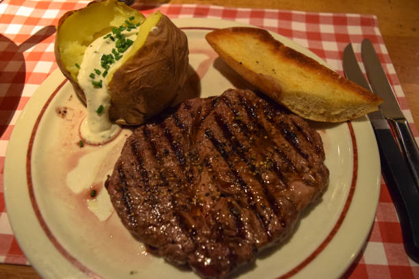 istock German steak. Medium rare roast beef with sauce and potato 666573348