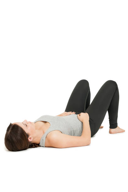 Yoga woman gray_anada balasana_variation stock photo