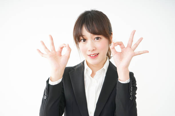 istock Young business woman showing OK gesture 666579996