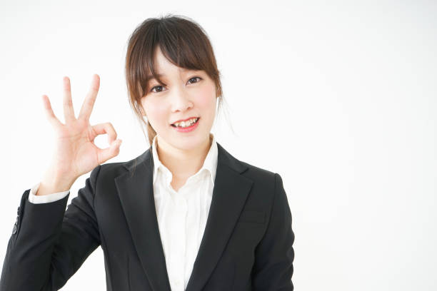 istock Young business woman showing OK gesture 666580004