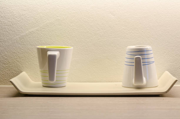istock Two white coffee cup in the room 666582784