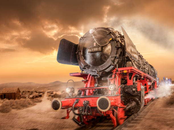 Steam locomotive drives through the desert stock photo
