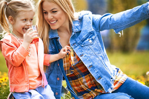 istock Mother and Daughter in the Park 666586420